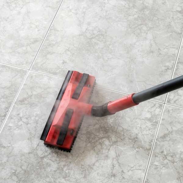 Steam cleaning grout in tile floor