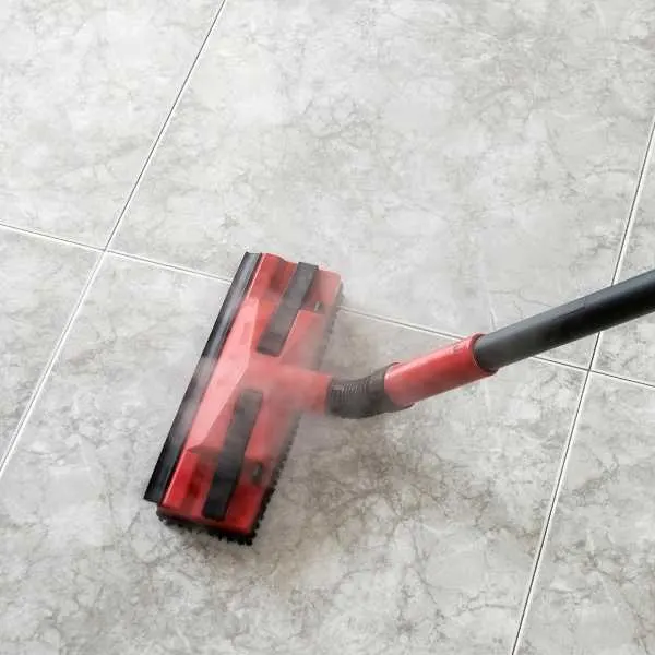 Steam cleaning grout in tile floor