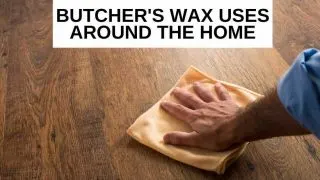 A man polishing a wood floor with a rag which is one of the Butcher's wax uses.