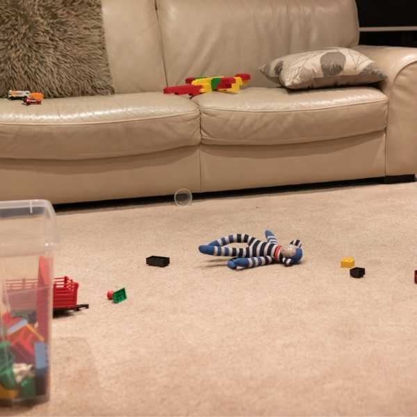 A living room cluttered with toys