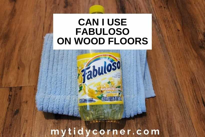 A bottle of Fabuloso on a rag on wood floor with text that says, "Can I use fabuloso on wood floors".