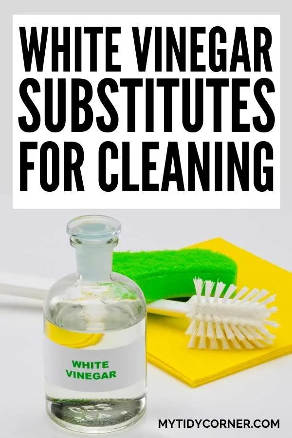 A bottle of vinegar, yellow and green sponges and a brush with text that says, "White vinegar substitutes".
