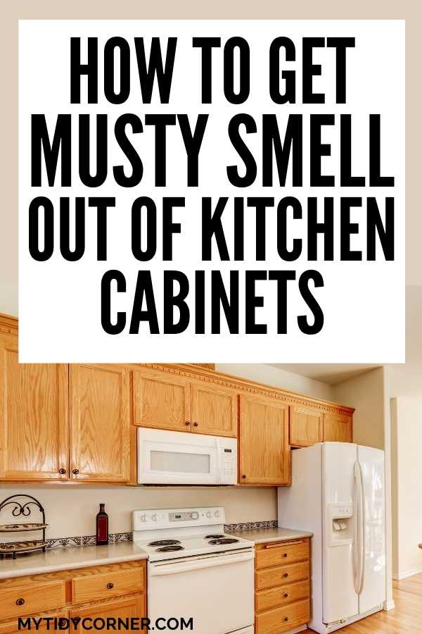 Cabinets, stove, fridge with text that says, "How to get musty smell out of kitchen cabinets".