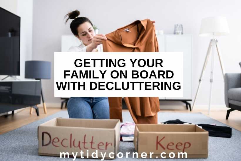 A woman holding a brown dress, two boxes (declutter and keep) with text that says, "Getting your family on board with decluttering" .