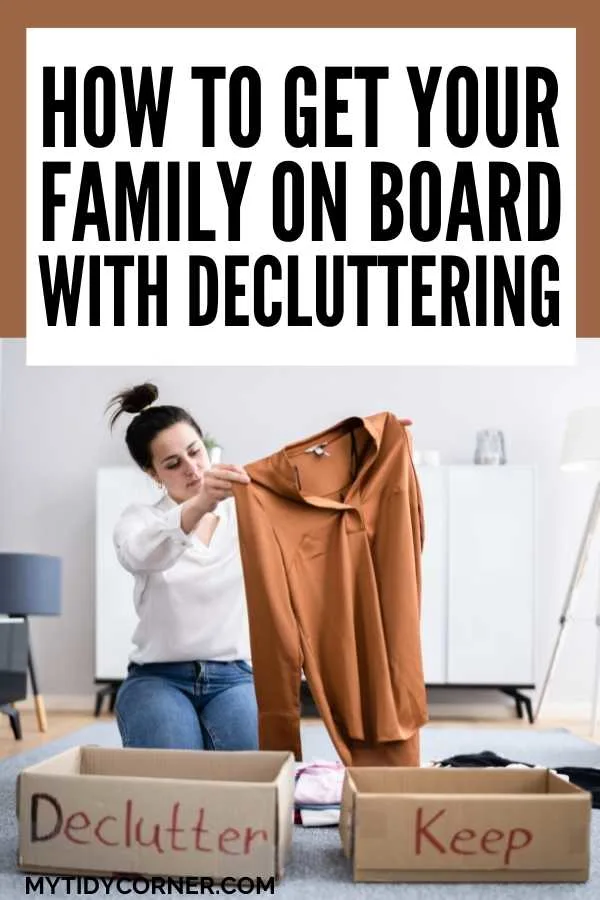 Woman holding up a brown shirt, two boxes (declutter, keep) with text that says, "How to get your family on board with decluttering".