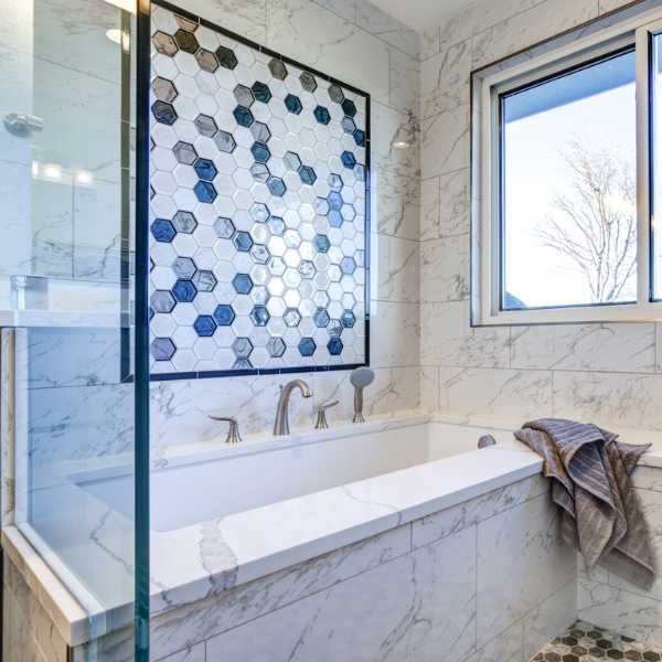 Marble bathtub and accent wall