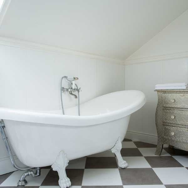 Bathroom with black and white tile floor