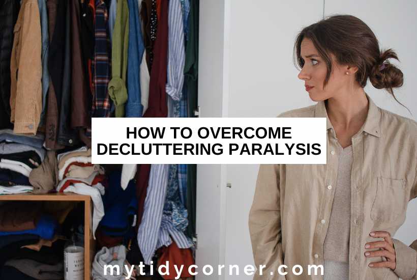 A woman with a hand on her hip looking at a closet full of clothes with text overlay that reads, "How to overcome decluttering paralysis".