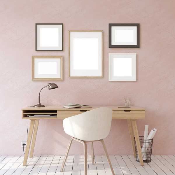 Home office with blush pink wall.