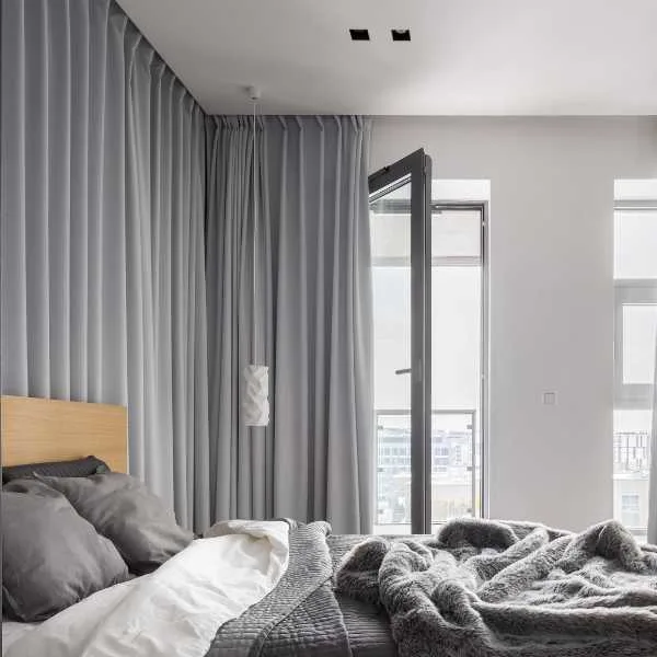 Bedroom with gray curtains.