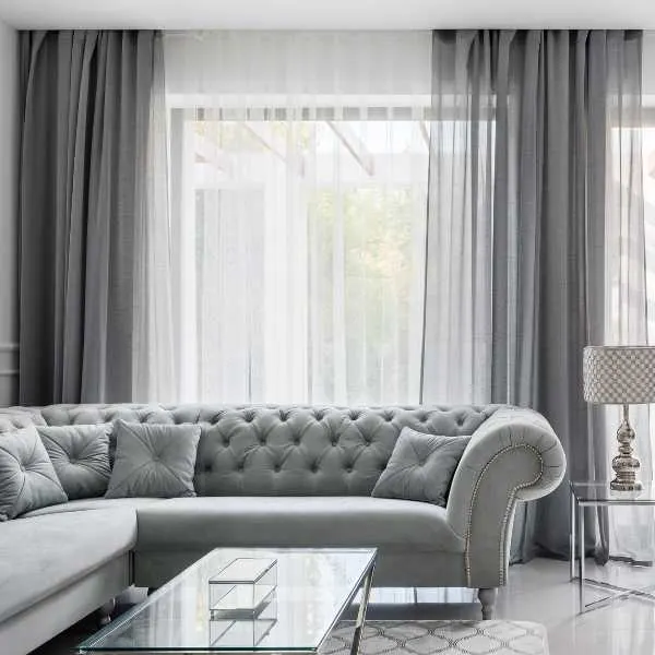 Living room with light gray curtains.