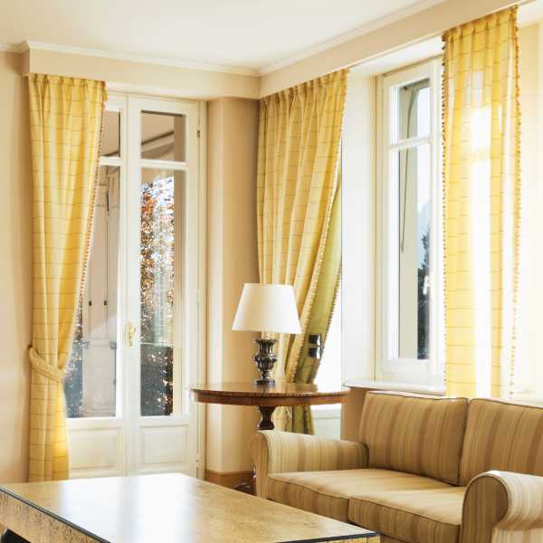 Living room with yellow curtains.