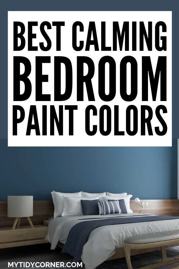 A bed in from of a blue wall, table lamp and text overlay that reads, "Best calming bedroom paint walls".