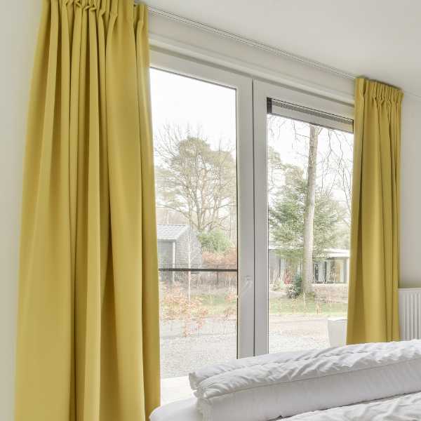 A room with yellow curtains.