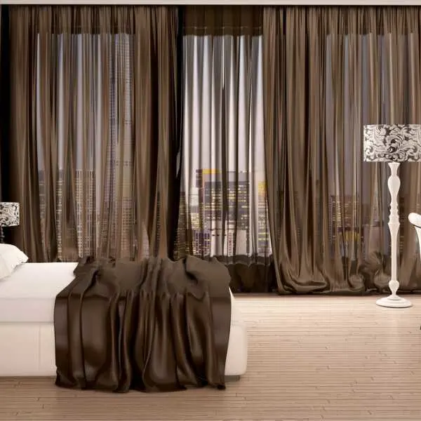 Bedroom with brown curtains.