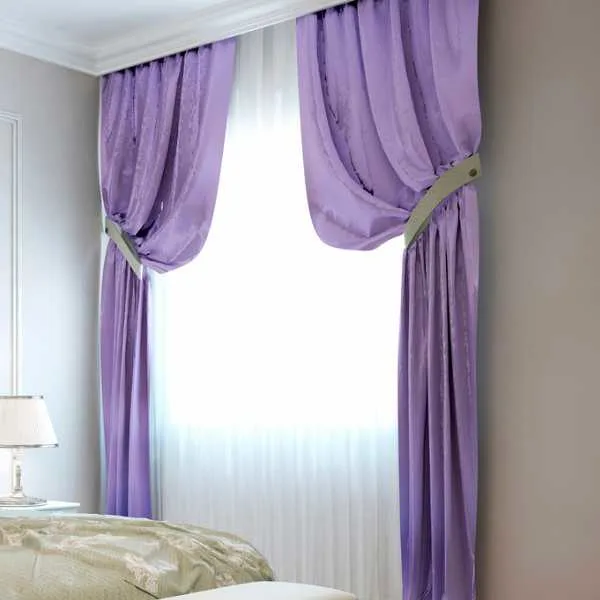 Bedroom with purple curtains.
