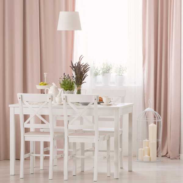 Dining room with pink curtains.