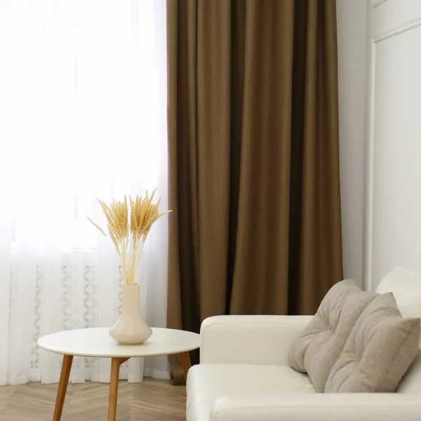 Room with brown curtain.