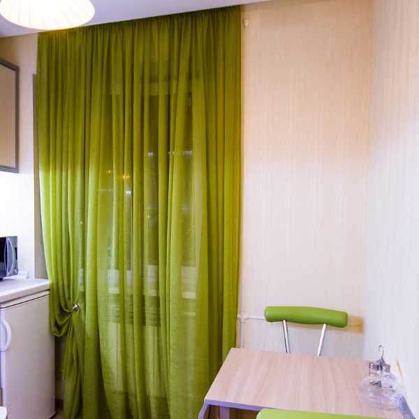 Room with green curtain.