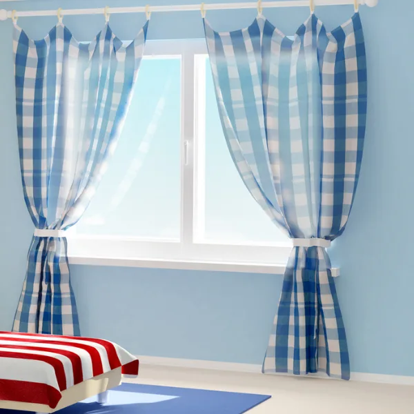 Blue room with patterned curtains.