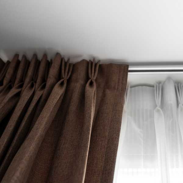 Pinch pleat curtains.