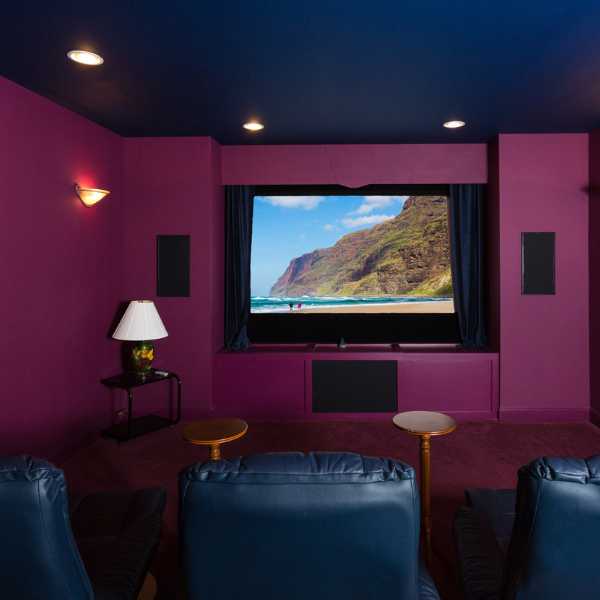 Home movie room with dark blue ceiling.