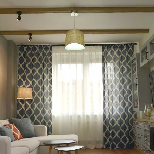 Modern room with patterned curtains.