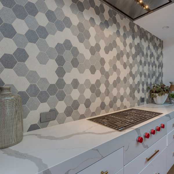 A modern kitchen with mosaic splashback.