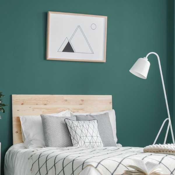 Bedroom with teal wall.