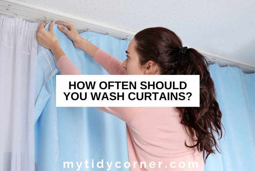 A woman hanging a curtain and text overlay that reads, "How often should you wash curtains?"