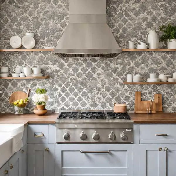 Kitchen with wallpaper splashback.