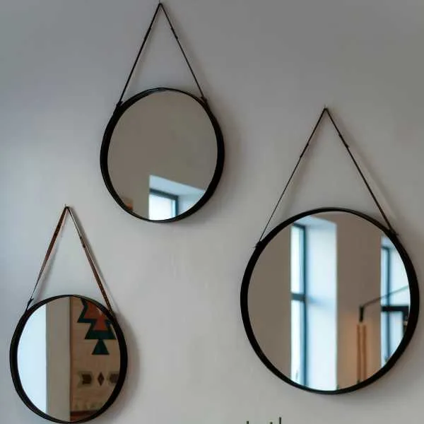 Decorative mirrors hanging on a wall.