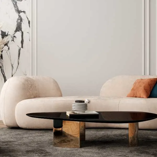 Curved boucle sofa and wooden coffee table.