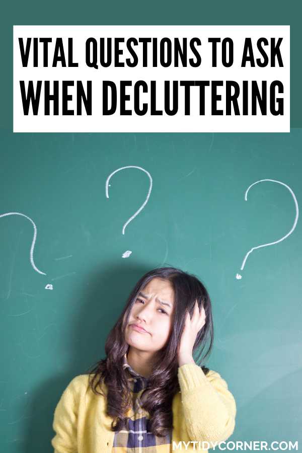 A woman holding her head, question marks on a green wall and text overlay that reads, "Vital questions to ask when decluttering".