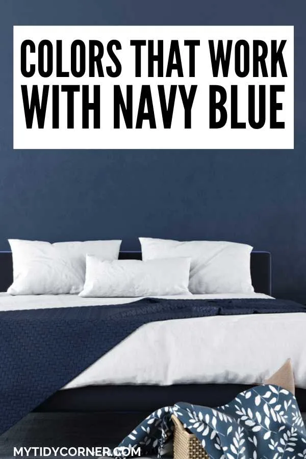 White and dark blue bedroom and text overlay that reads, "Colors that work with navy blue".