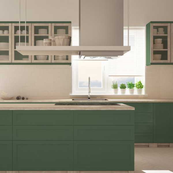 Kitchen with forest green cabinets.