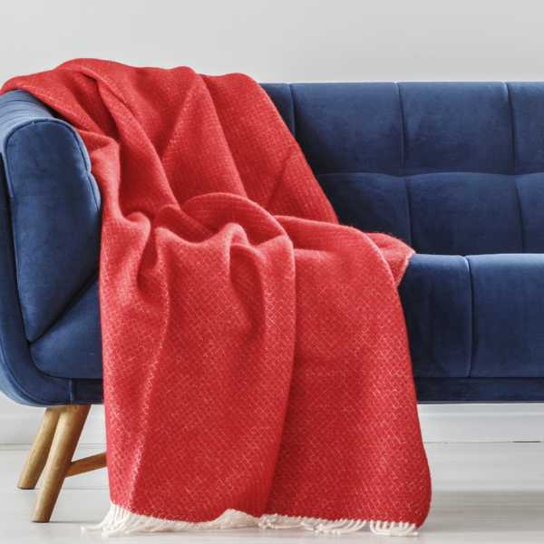 Red throw on blue couch.