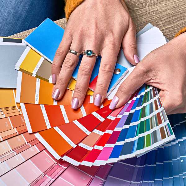 Someone holding a color wheel swatch.