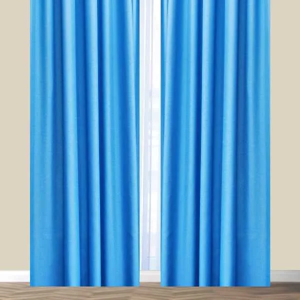Blue curtains on tan wall.