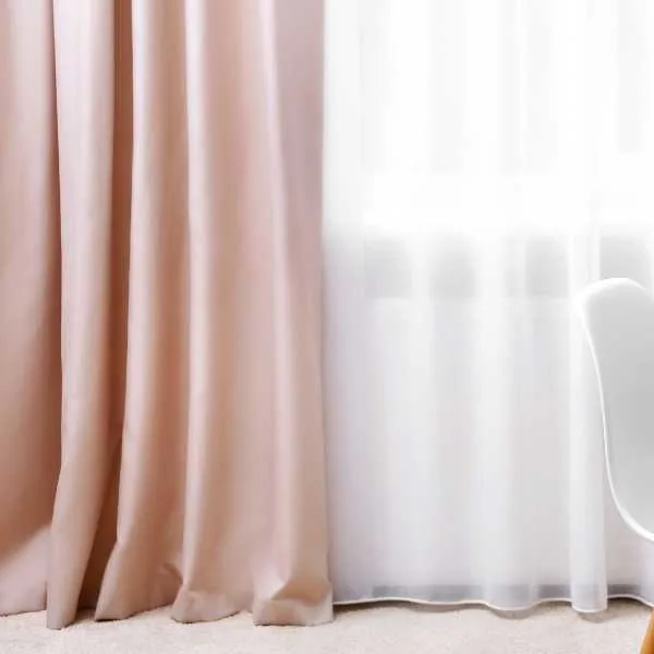 Blush pink and white sheer curtains.