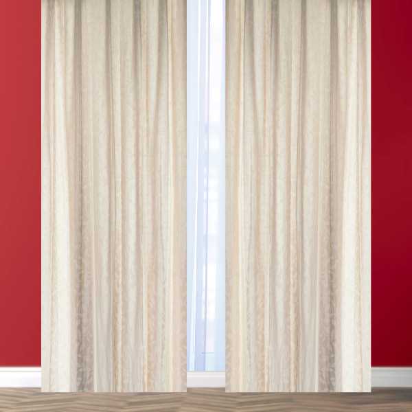 Cream curtains on red wall.