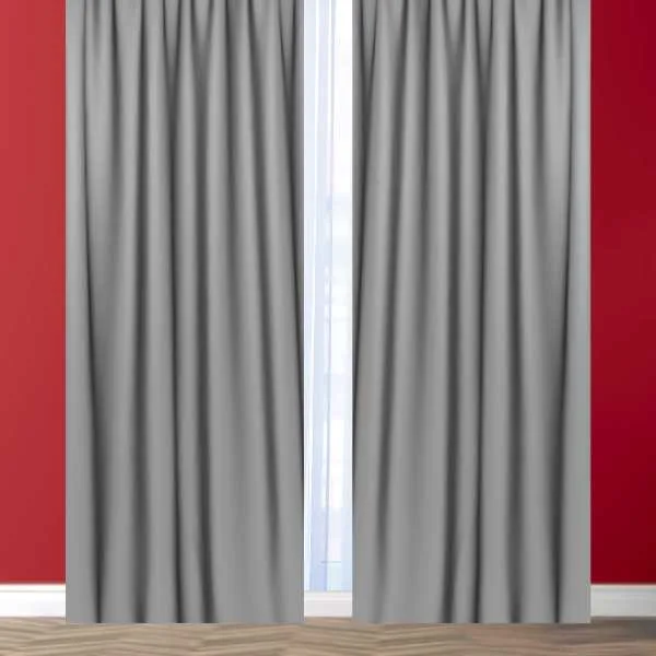Gray curtains on red wall.
