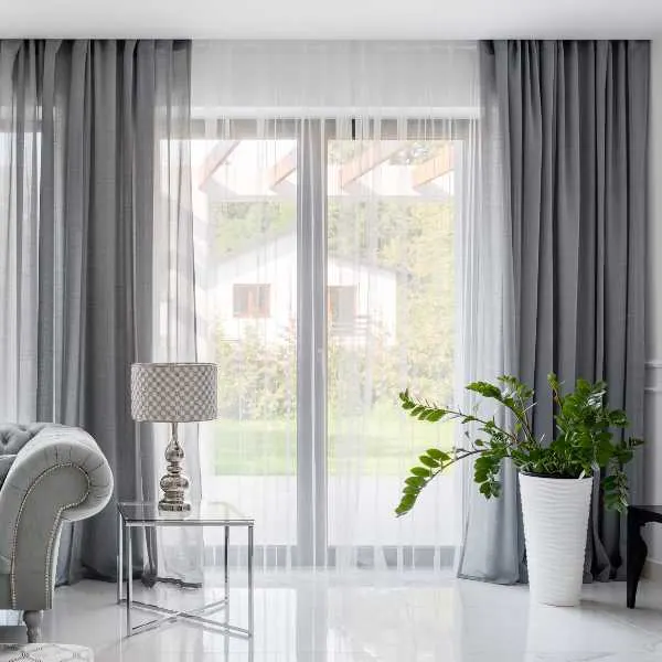 Neutral living room with gray curtains.