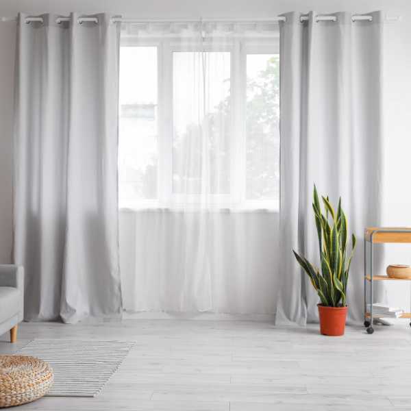 Room with gray curtains and wall.