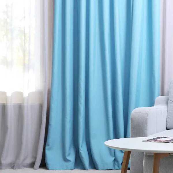 Room with white and blue curtains.