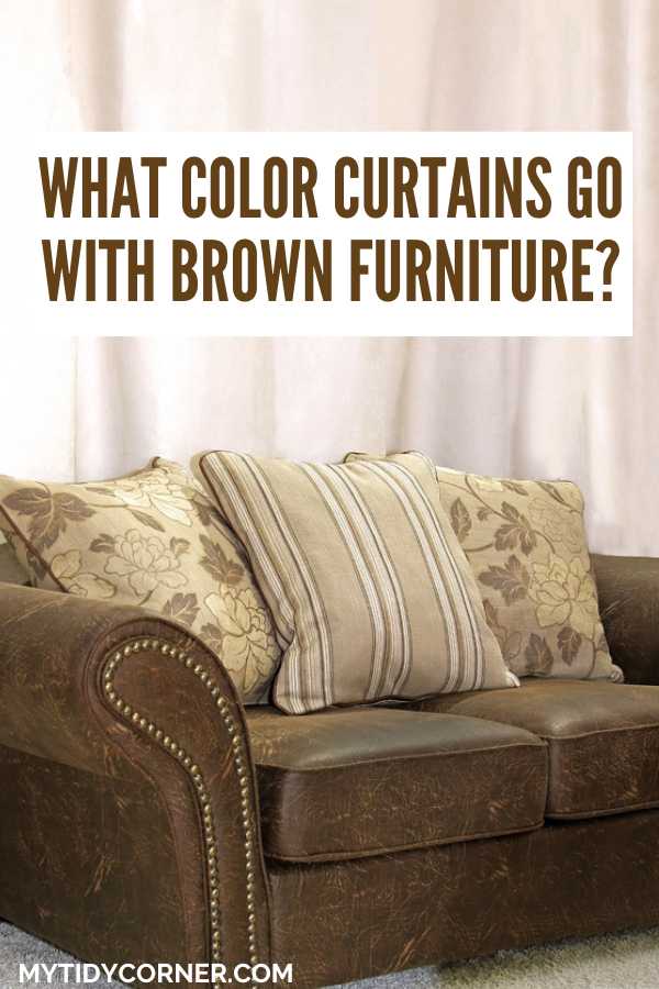Brown couch, throw pillows, cream drape and text overlay that says, "What color curtains go with brown furniture?".