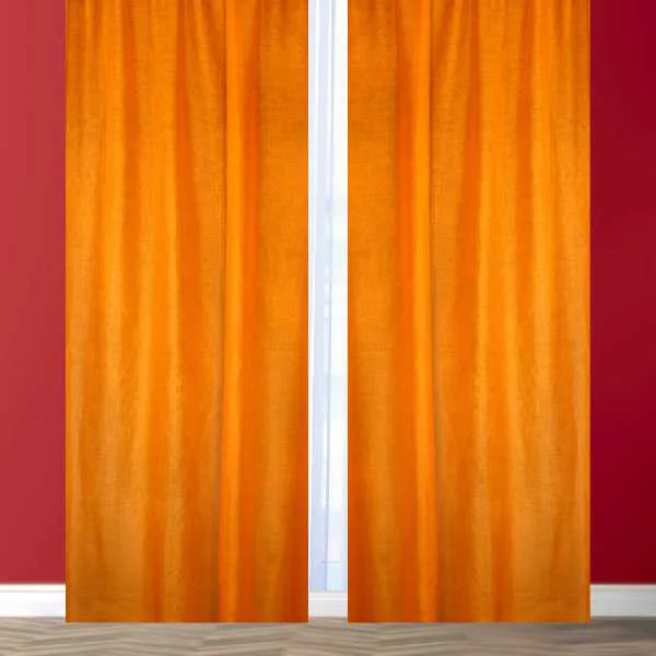 Bright orange curtains on red wall.