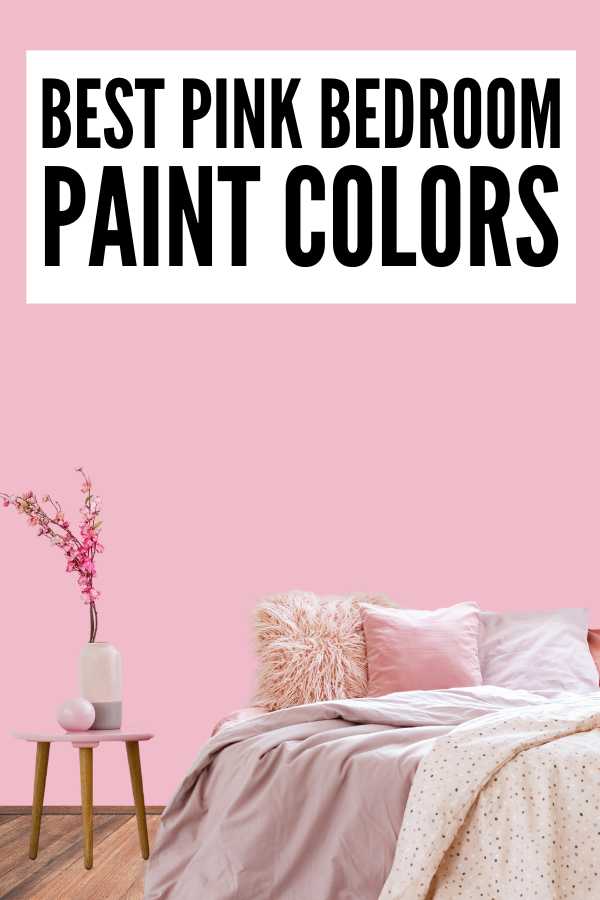 Room with pink wall background and wood floor, bed, assorted colors of pillows, flower vase on a stool and text overlay that says, "Best pink bedroom paint colors".