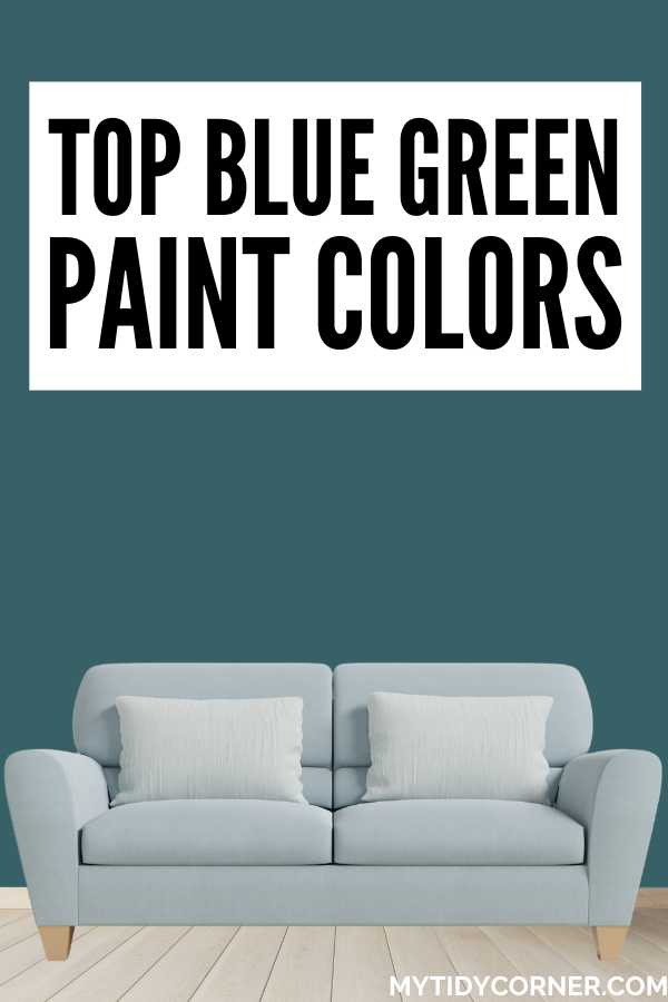 White wood floor, wall painted with Sherwin-Williams Deep Sea Dive, white pillows on a bluish gray couch and text overlay that says, "Top blue green paint colors".