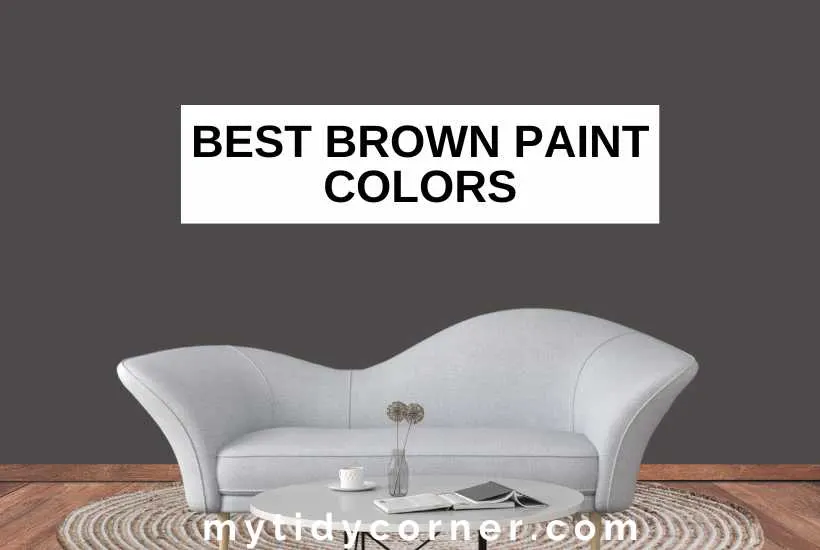 Brown wall background, books and other stuff on a coffee table, white sofa on beige rug, wood floor and text overlay that says, "Best brown paint colors".